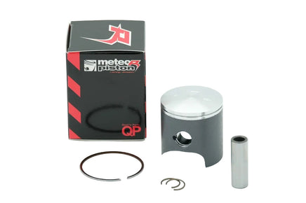 A piston for a KTM motorcycle, including the piston itself, piston rings, a wrist pin, and a box with the KTM logo on it.
